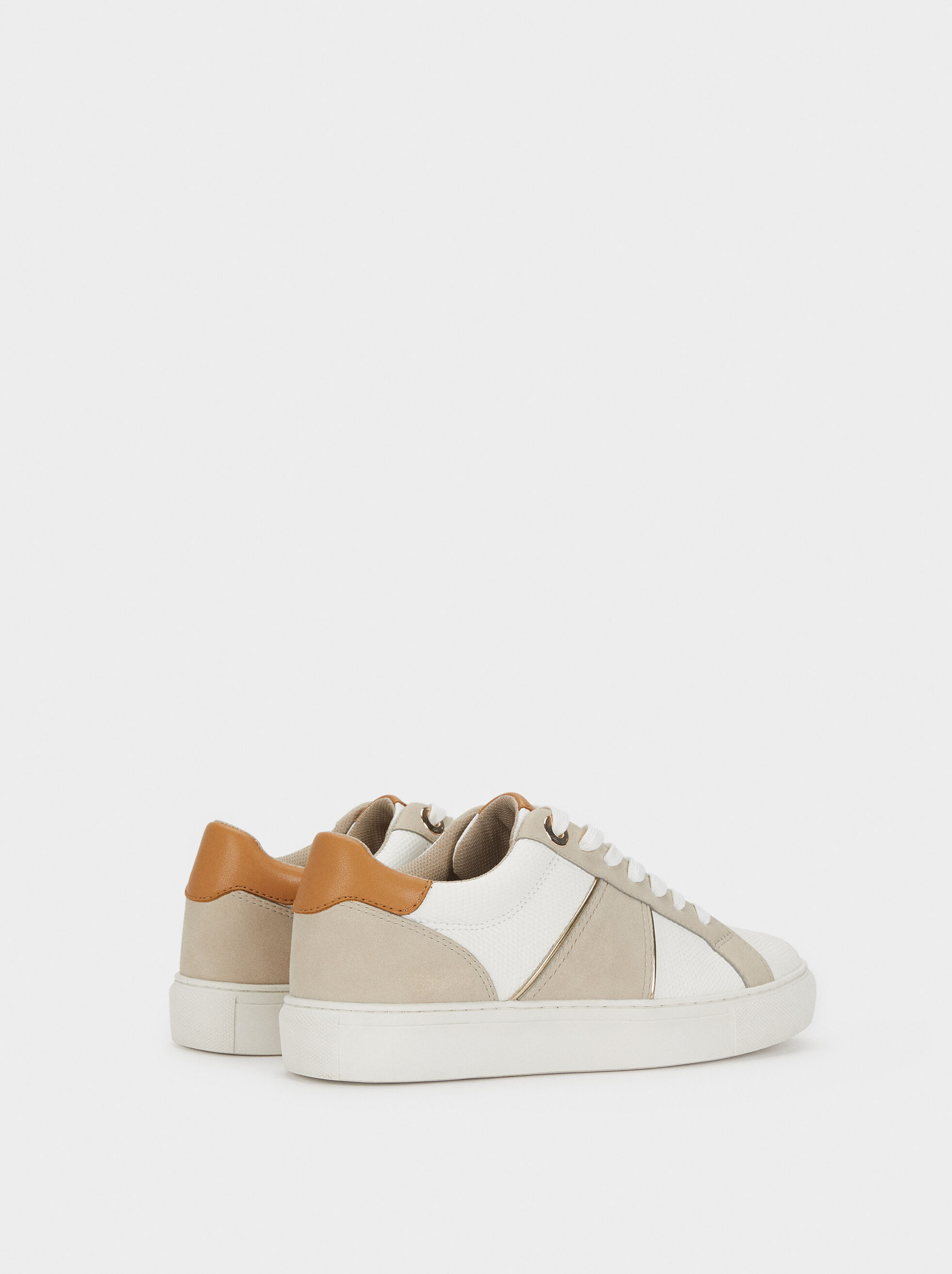 white and tan trainers